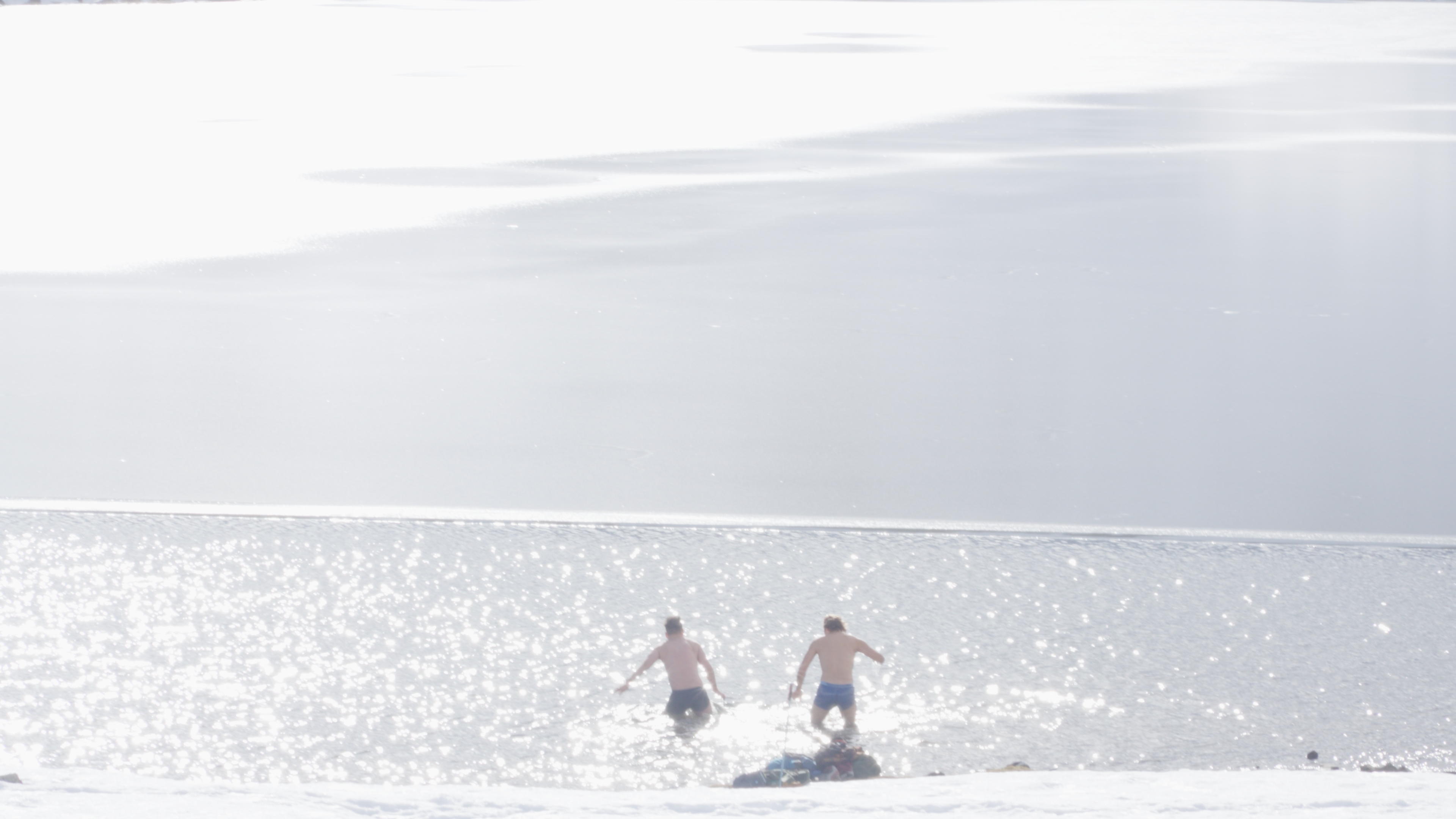 Winter swim in a mountain lake